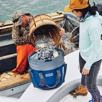 YETI Hopper® M30 Tote Soft Cooler PDP Overview Image Lifestyle New M30 Inline Navy 1x YETI Cooler Shop