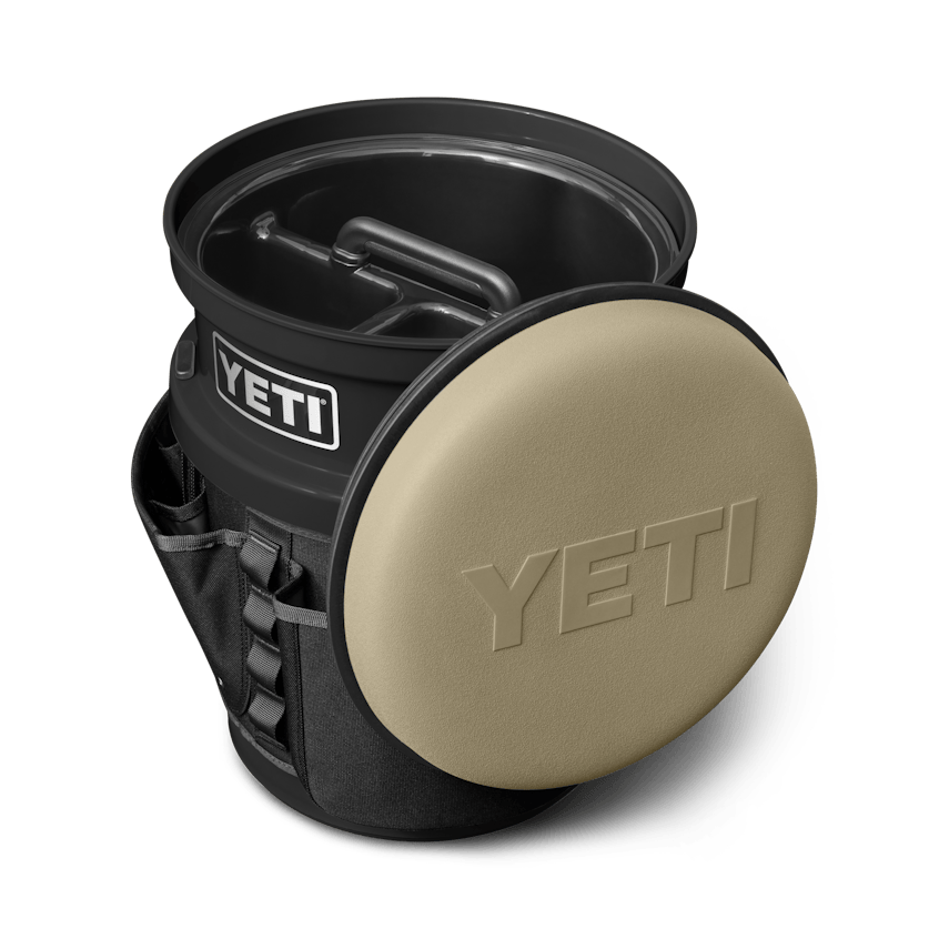The Fully-Loaded Bucket With Tan Swivel Seat Site Studio Outdoor Living Loadout Bucket Swivel Seat Tan on Black 3qter Loaded 10527 B 2400x2400 YETI Cooler Shop
