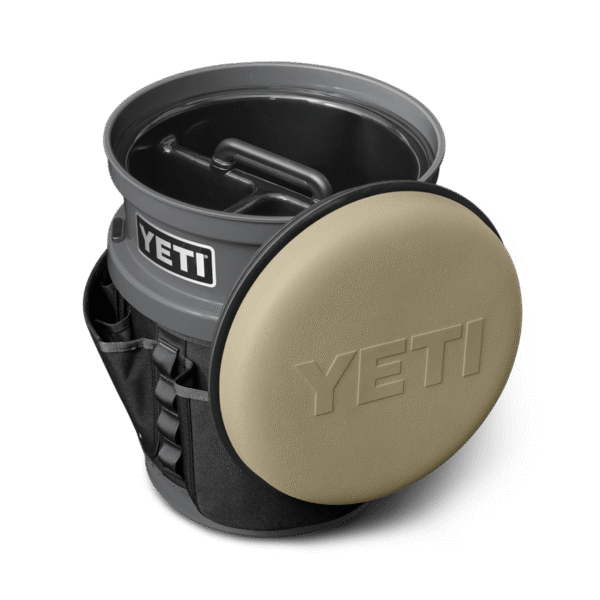 The Fully-Loaded Bucket  With Tan Swivel Seat Site Studio Outdoor Living Loadout Bucket Swivel Seat Tan on Charcoal 3qter Loaded 10527 B 2400x2400 YETI Cooler Shop