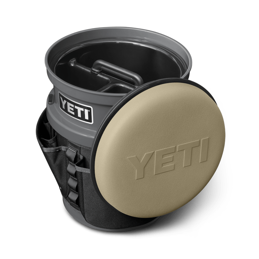 The Fully-Loaded Bucket With Tan Swivel Seat Site Studio Outdoor Living Loadout Bucket Swivel Seat Tan on Charcoal 3qter Loaded 10527 B 2400x2400 YETI Cooler Shop