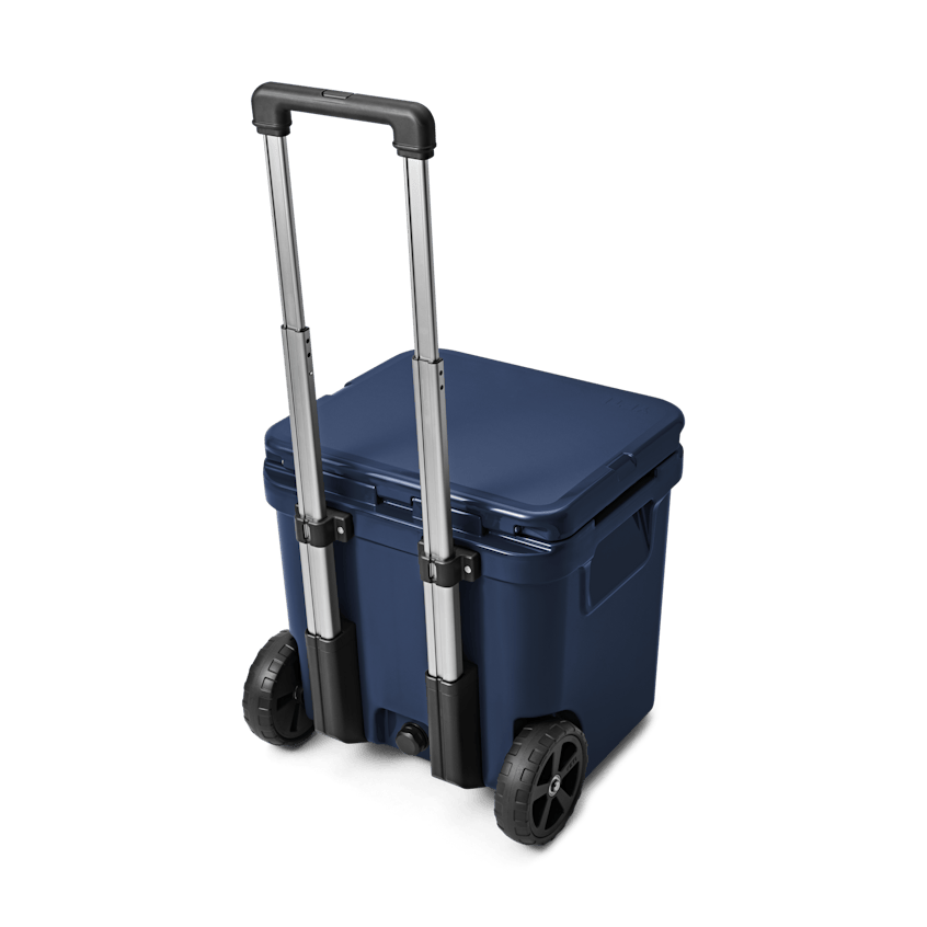 YETI Roadie® 48 Wheeled Cooler W 220022 site studio Hard Coolers Roadie 48 Navy 3qtr Back Handle Up 7801 Primary B 2400x2400 yeticoolershop.com