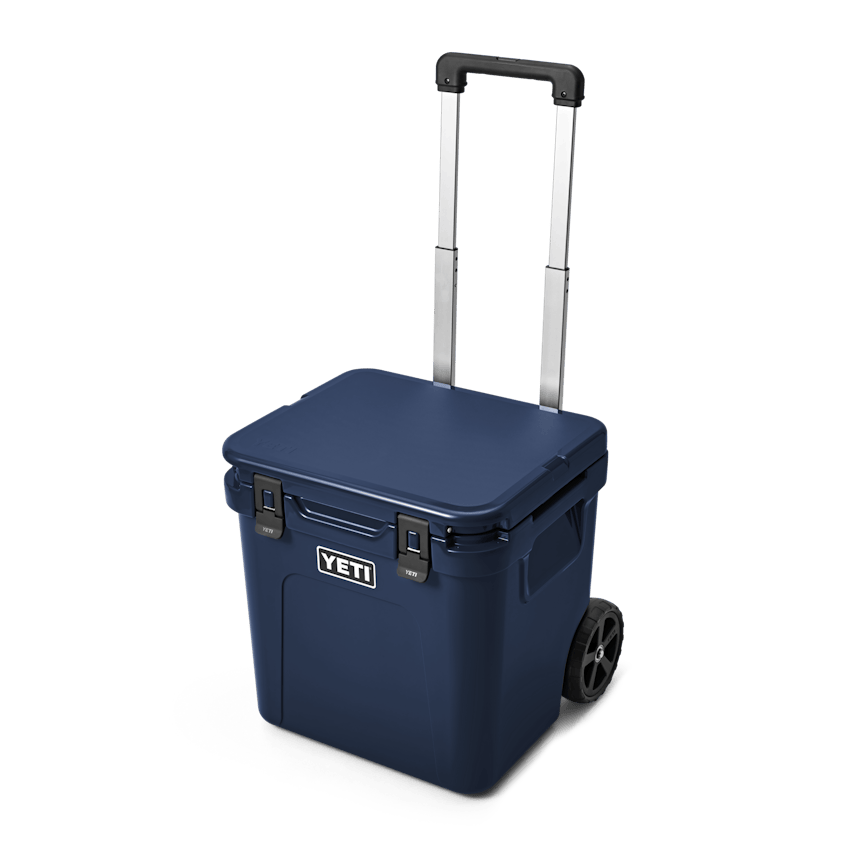 YETI Roadie® 48 Wheeled Cooler W 220022 site studio Hard Coolers Roadie 48 Navy 3qtr Front Handle Up 7795 Primary B 2400x2400 yeticoolershop.com