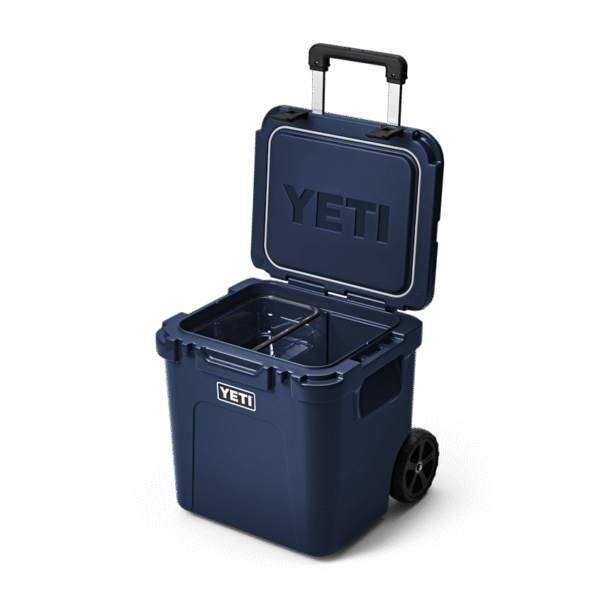 YETI Roadie® 48 Wheeled Cooler W 220022 site studio Hard Coolers Roadie 48 Navy 3qtr Open 6945 Primary B 2400x2400 yeticoolershop.com
