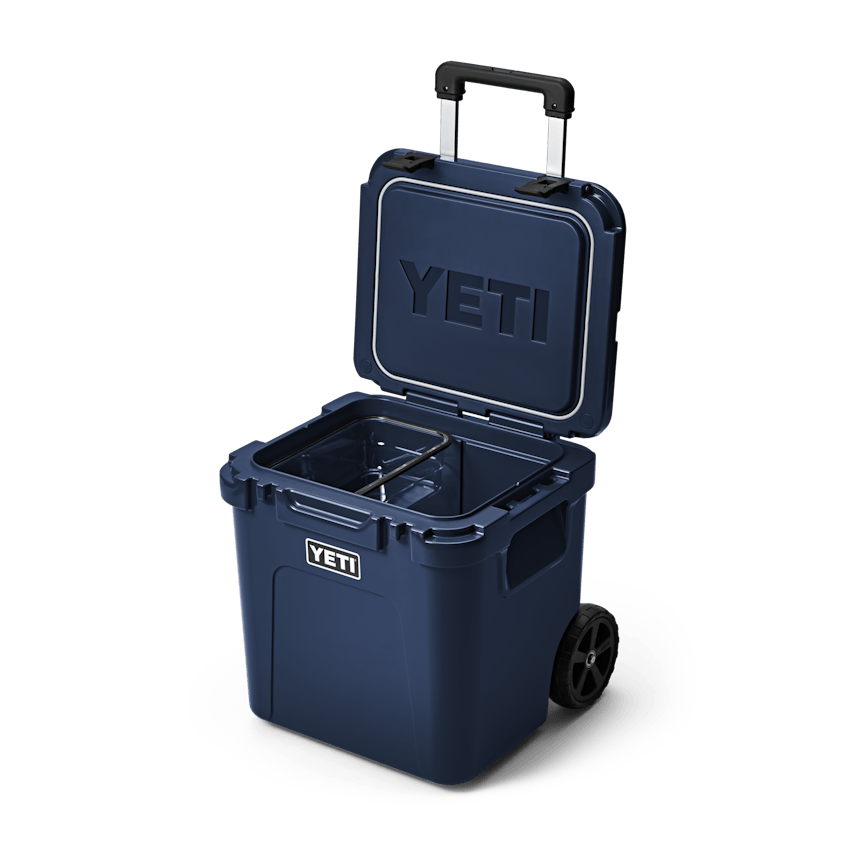 YETI Roadie® 48 Wheeled Cooler W 220022 site studio Hard Coolers Roadie 48 Navy 3qtr Open 6945 Primary B 2400x2400 yeticoolershop.com