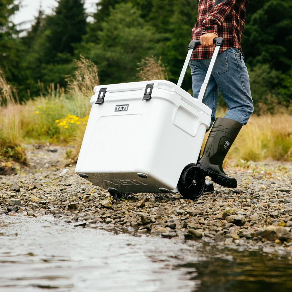 The roadie 60 wheeled cooler prepared for a tailgating event on a truck bed