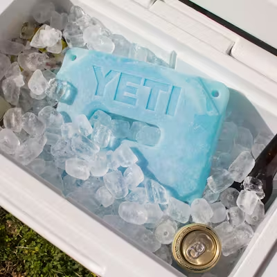 Comparison of how long does yeti ice last versus traditional bagged ice inside a premium insulated cooler.