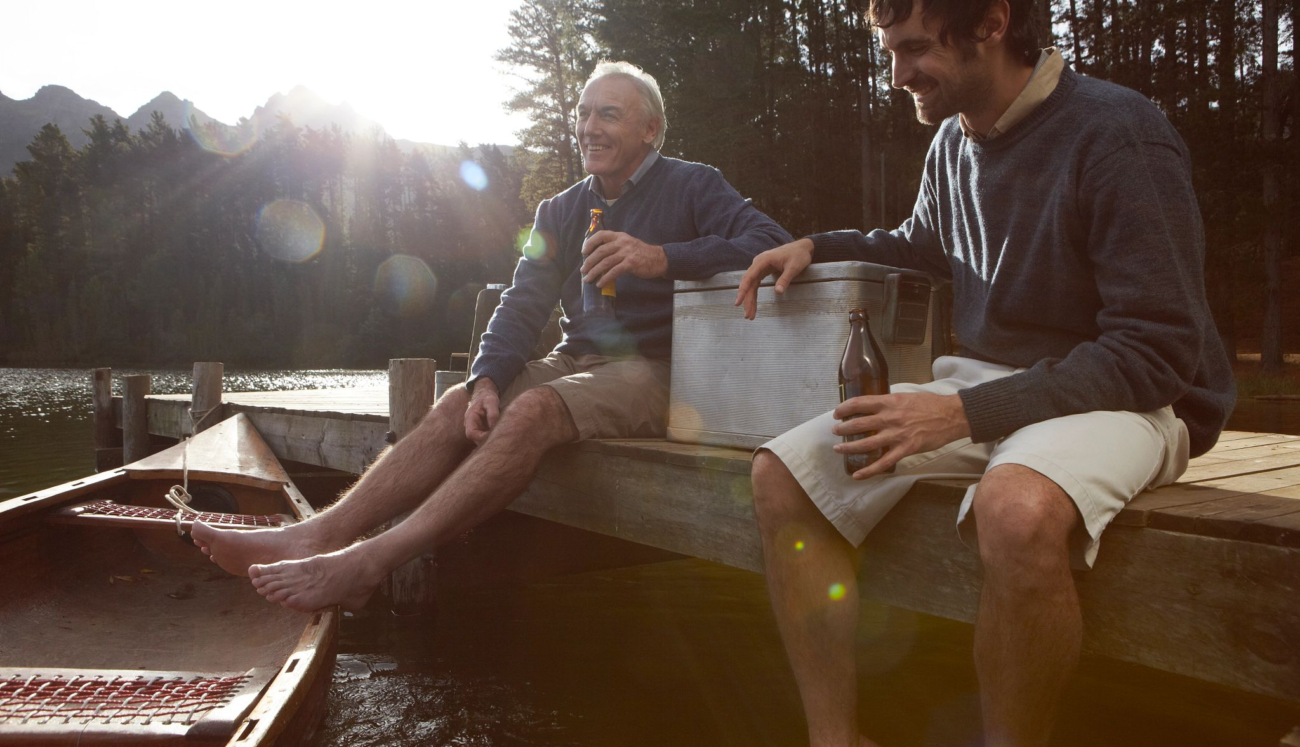 yeti 60 quart cooler sitting on a wooden dock next to a lake