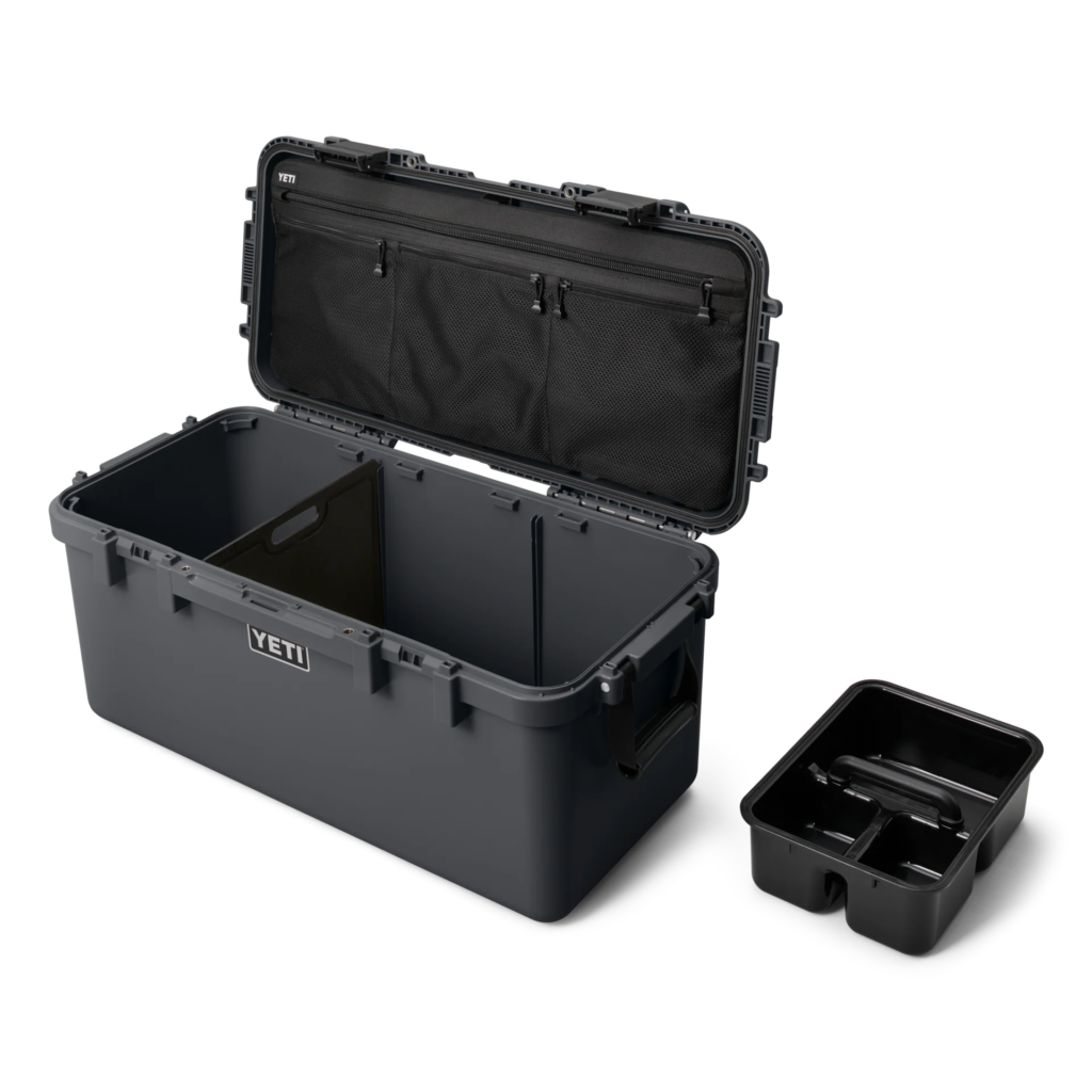 Organized yeti gear storage boxes and buckets in a vehicle for a camping trip