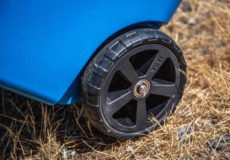 Close up of the rugged wheels on a yeti roadie wheeled cooler for tough terrain